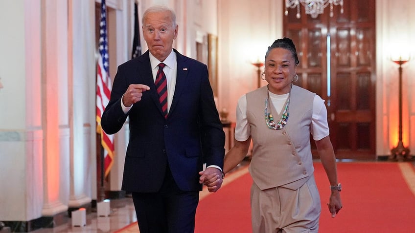 Joe Biden points at Dawn Staley