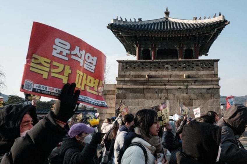 South Korean protesters held mass weekend demonstrations against and in support of impeach