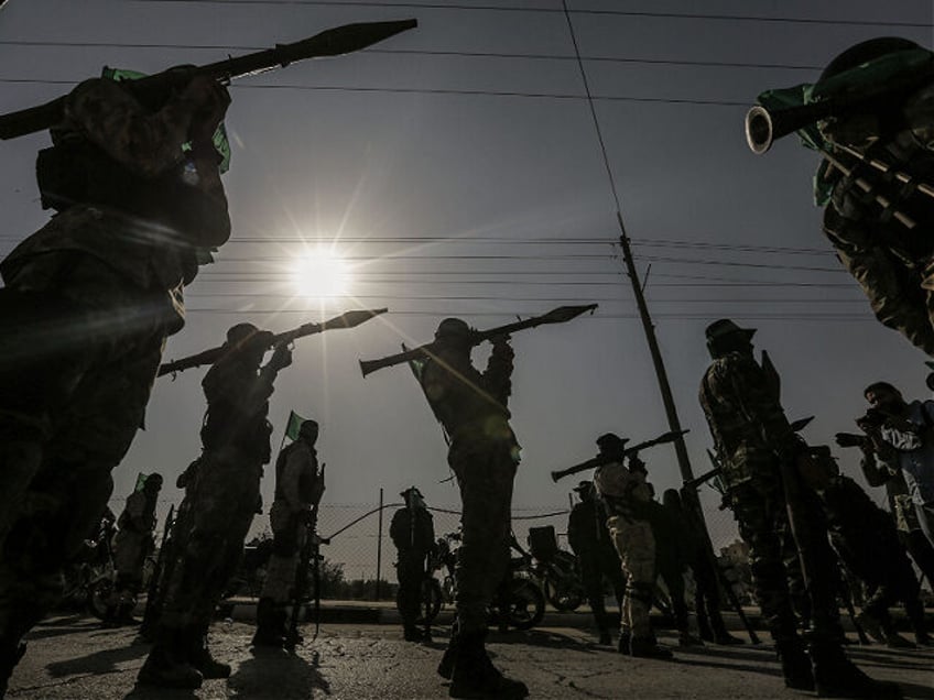 11 November 2019, Palestinian Territories, Khan Yunis: Members of Izz ad-Din al-Qassam Brigades, the military wing of the Palestinian Hamas organization, march with RPGs during an anti-Israel military parade. Photo: Mohammed Talatene/dpa (Photo by Mohammed Talatene/picture alliance via Getty Images)