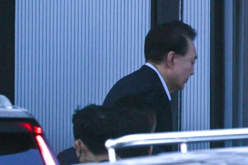 South Korea's impeached President Yoon Suk Yeol arrives at the complex building housing th