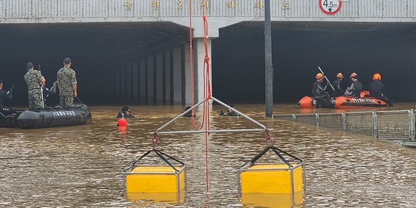 south korean rescuers pull 9 bodies from flooded tunnel where 15 vehicles were trapped