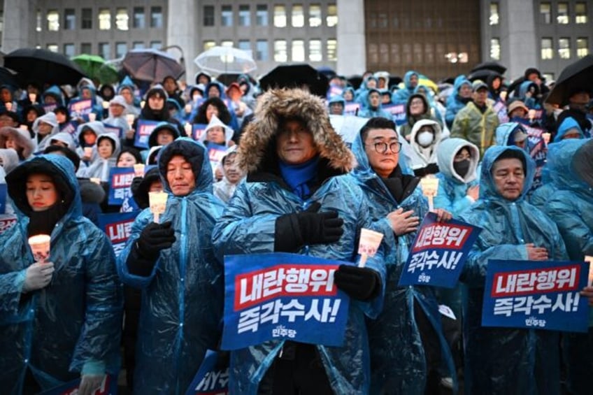 Protesters take part in a candlelight rally calling for the ouster of South Korea Presiden