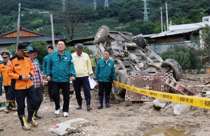 south koreas death toll from destructive rainstorm grows to 40 as workers search for survivors