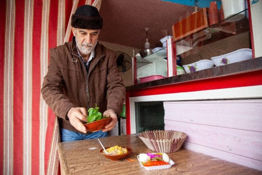 Hussein Murtada says he works 'under the bombs' to prepare falafel in his village near the Israeli border