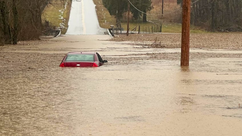 A partially submerged car