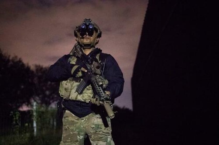 southern border cameras capture heavily armed cartel illegally entering us