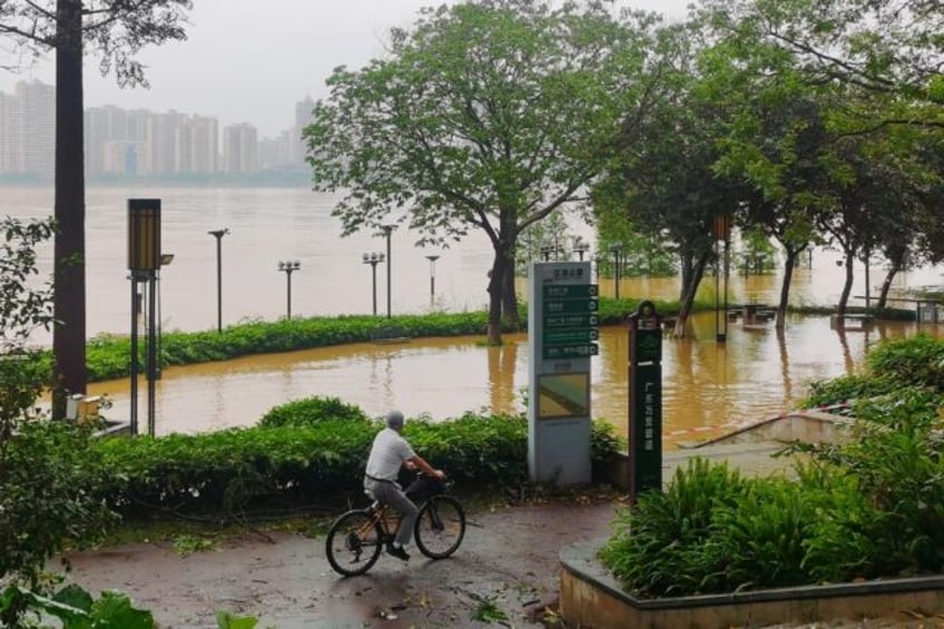 Heavy rains have hit southern China, prompting tens of thousands to be evacuated, includin
