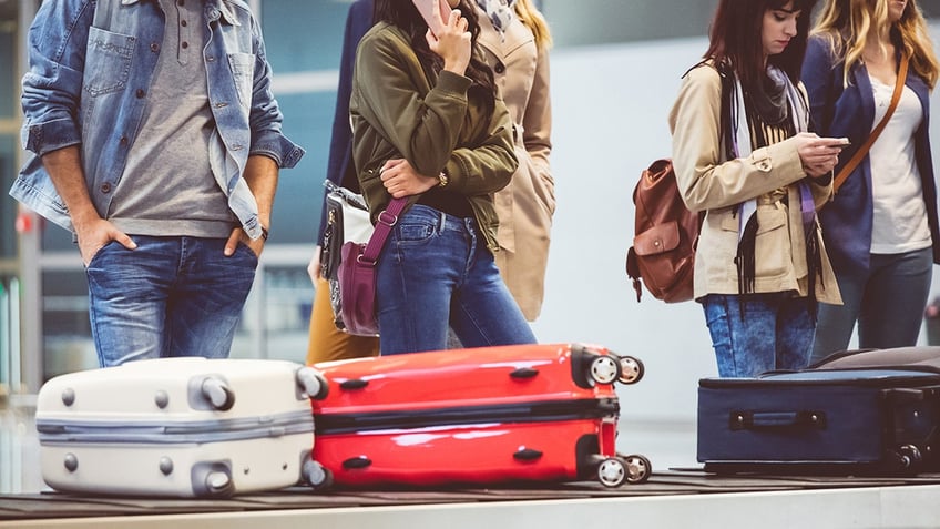 waiting for luggage at baggage claim