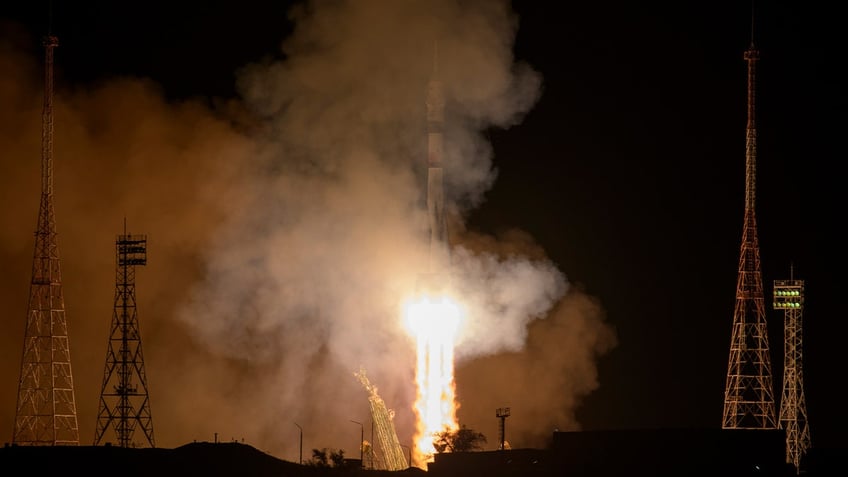 soyuz docks at international space station with two russians one american