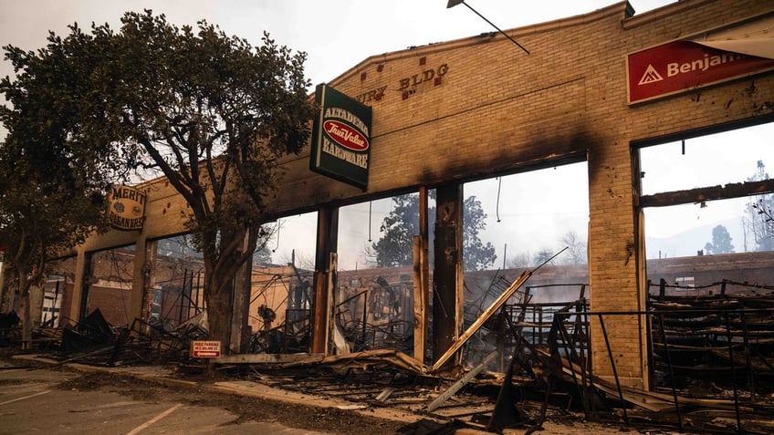 ALTADENA, CA - JANUARY 08: The brick frame of Altadena Hardware still stands on Wednesday, January 8, 2025 after the Eaton fire burned through Altadena's town center. Over 1,000 structures have burned, with two people dead, in wildfires fueled by intense Santa Ana Winds across L.A. County. (Photo by Sarah Reingewirtz/MediaNews Group/Los Angeles Daily News via Getty Images)