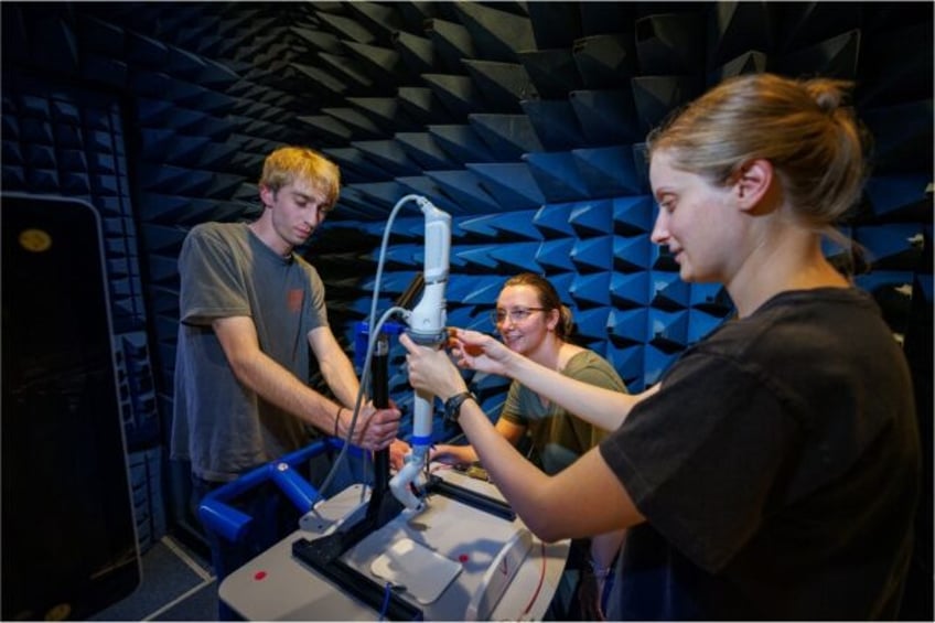 Students from the University of Nebraska work on a small surgical robot called spaceMIRA,