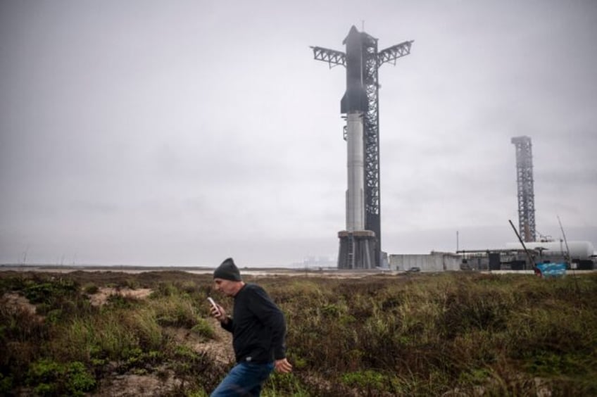 A visitor walks near the launch site of the SpaceX Starship rocket on January 14, 2025, ne