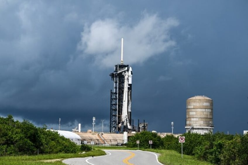 A SpaceX Falcon 9 rocket with the Crew Dragon Resilience capsule sits on Launch Complex 39