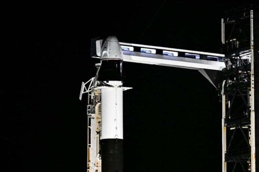 A SpaceX Falcon 9 rocket with the Crew Dragon Resilience capsule sits on Launch Complex 39