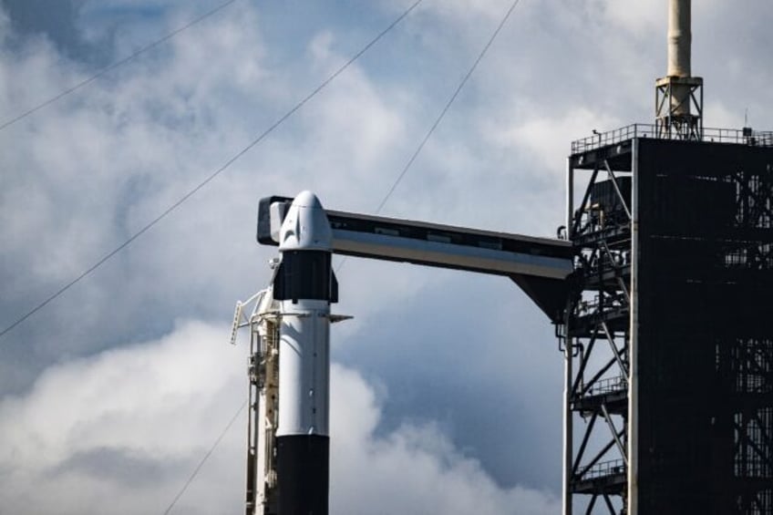 Riding atop a Falcon 9 rocket, the SpaceX Dragon capsule is set to reach a peak altitude o