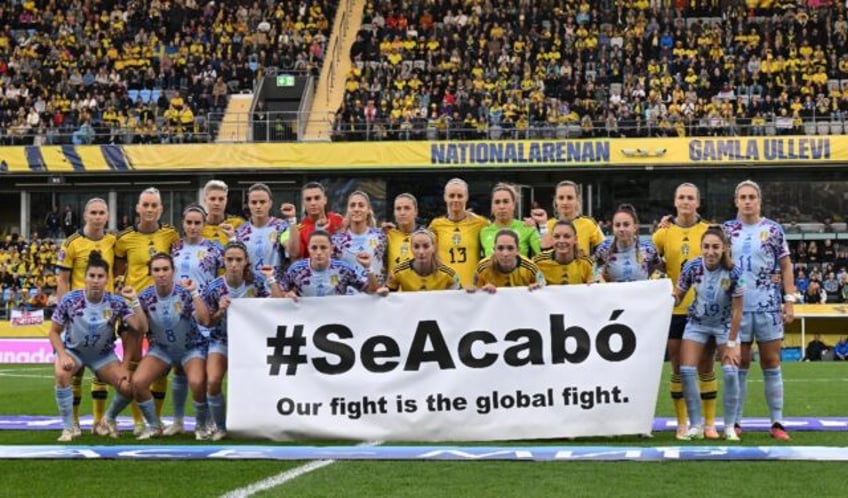 spain and sweden womens footballers stage its over protest