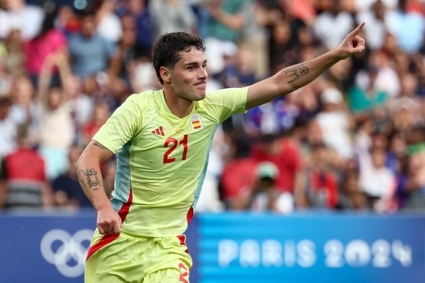 Sergio Camello celebrates after scoring Spain's fourth goal in a classic Olympic men's foo