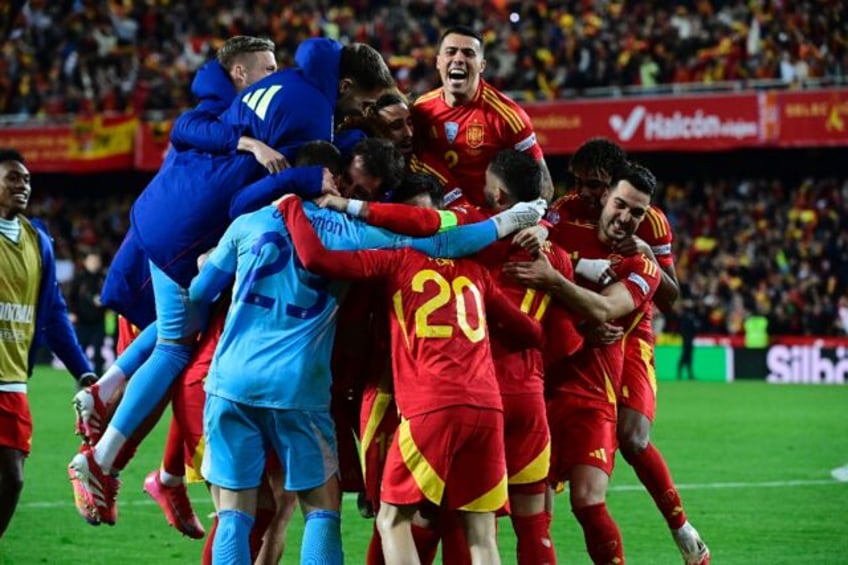 Spain's players celebrate after the UEFA Nations League quarter-final win over Netherlands