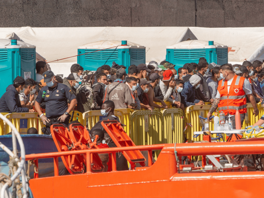 A group of migrants arrive at the Port of Arguineguin after being rescued by the Spanish c