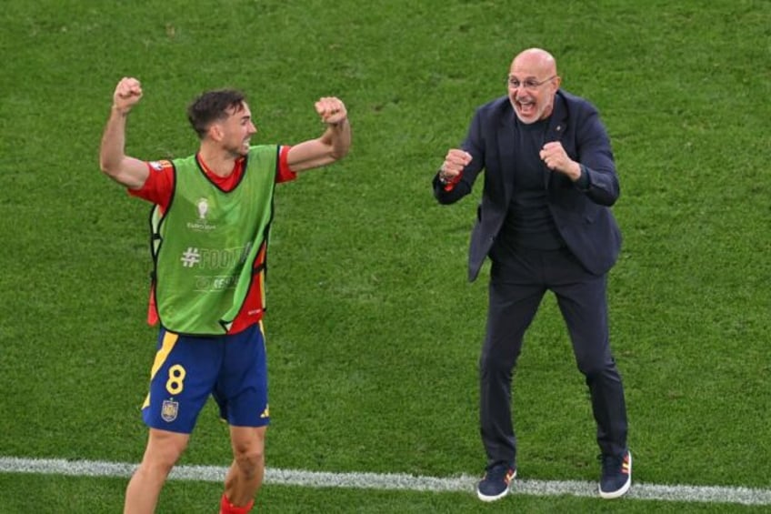 Luis de la Fuente (R) celebrates after Spain progressed to the Euro 2024 semi-finals