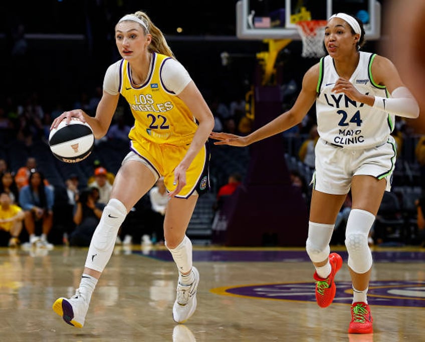 Cameron Brink of the Los Angeles Sparks controls the ball against Napheesa Collier of the Minnesota Lynx at Crypto.com Arena on June 05, 2024 in Los...