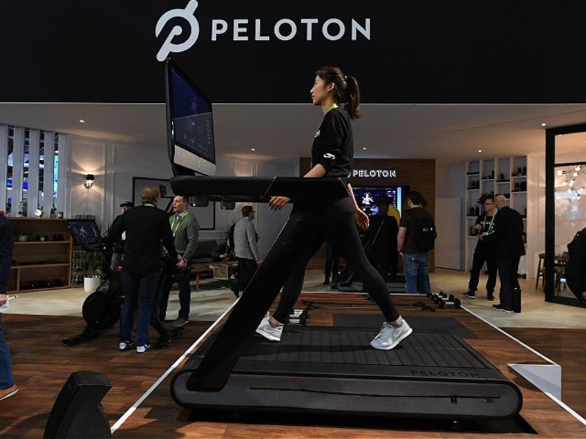 LAS VEGAS, NV - JANUARY 11: Maggie Lu uses a Peloton Tread treadmill during CES 2018 at the Las Vegas Convention Center on January 11, 2018 in Las Vegas, Nevada. The USD 3,995 workout machine is expected to be available later this year and features a 32-inch touch screen that connects users to instructors giving live or on-demand fitness classes. CES, the world's largest annual consumer technology trade show, runs through January 12 and features about 3,900 exhibitors showing off their latest products and services to more than 170,000 attendees. (Photo by Ethan Miller/Getty Images)