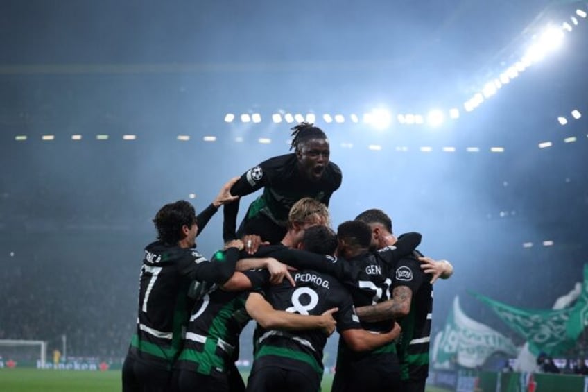 Sporting Lisbon's players celebrate after Swedish forward Viktor Gyokeres scored against M