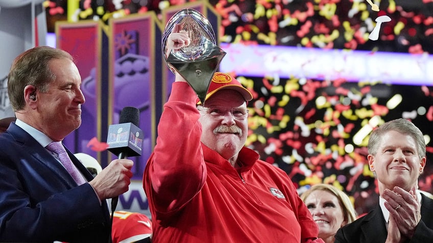 Andy Reid hoists trophy