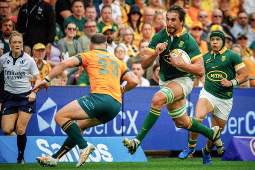 South Africa lock Eben Etzebeth (R) makes a charge against Australia in Brisbane during a