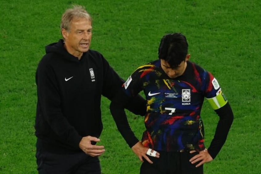 Jurgen Klinsmann and Son Heung-min after losing to Jordan