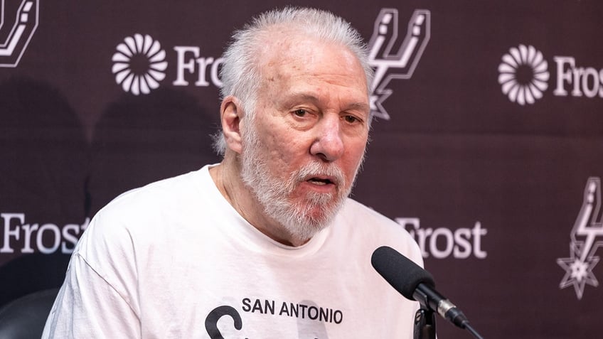 Gregg Popovich talks to reporters