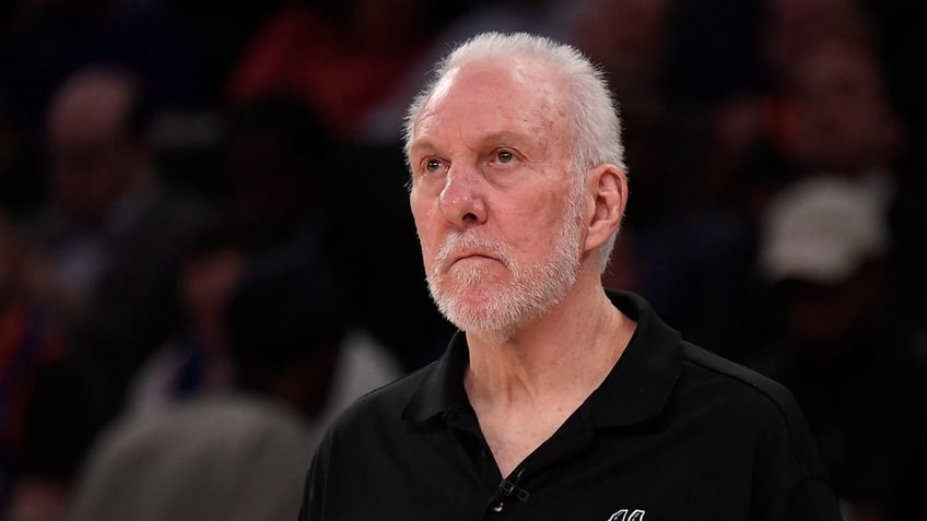 Gregg Popovich looks on court