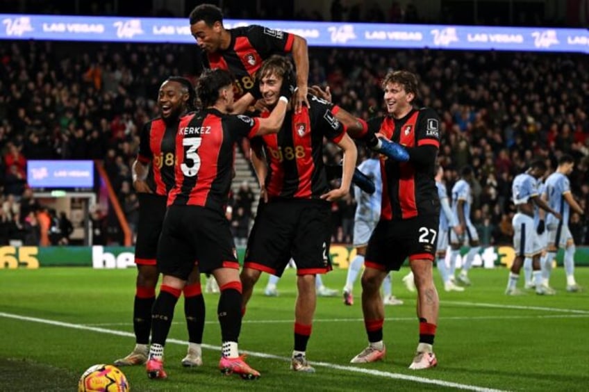 Bournemouth's Dean Huijsen (C) is mobbed after scoring against Tottenham