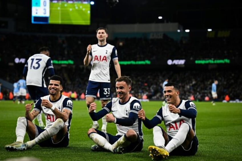 Tottenham defender Pedro Porro (R) celebrates with teammates after scoring the third goal