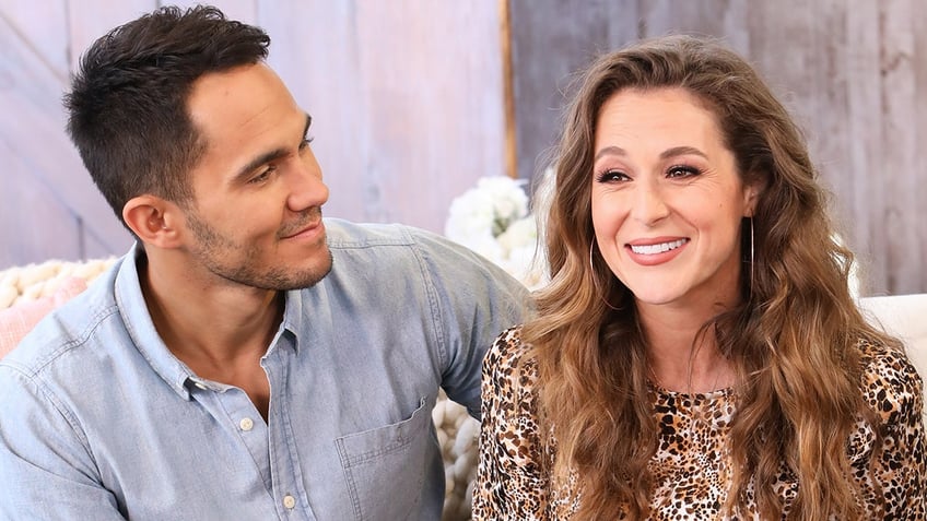 Carlos PenaVega looks lovingly at wife Alexa in a patterned top