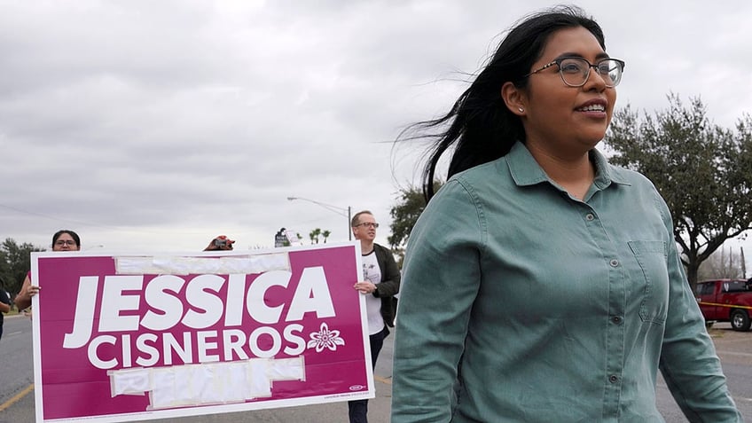 Democrat Jessica Cisneros, who is campaigning for a House seat, participates in the Citrus Parade to introduce herself to the attendees in Mission, Texas, Jan. 25, 2020. (REUTERS/Veronica Cardenas)