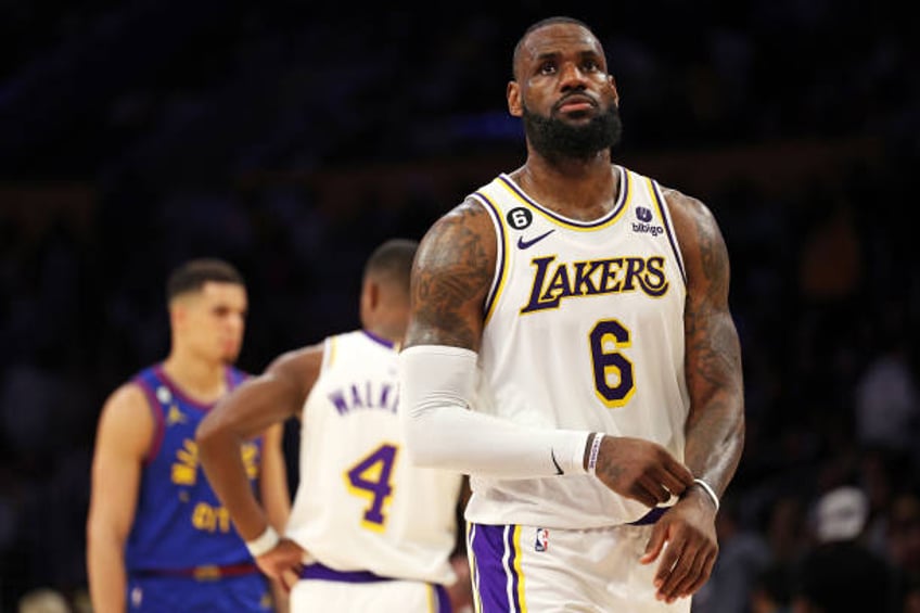 LeBron James of the Los Angeles Lakers reacts after missing a shot during the fourth quarter against the Denver Nuggets in game three of the Western...