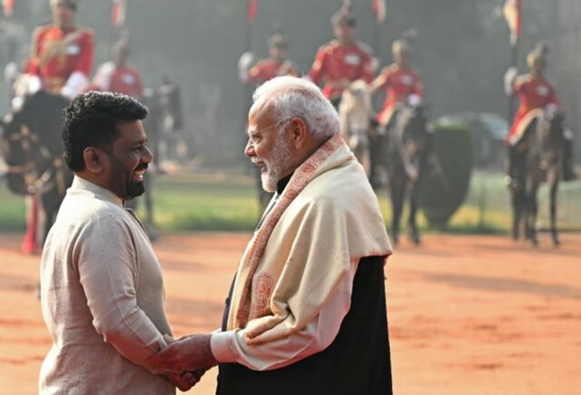 Sri Lanka's President Anura Kumara Dissanayake (L) speaks with India's Prime Minister Nare