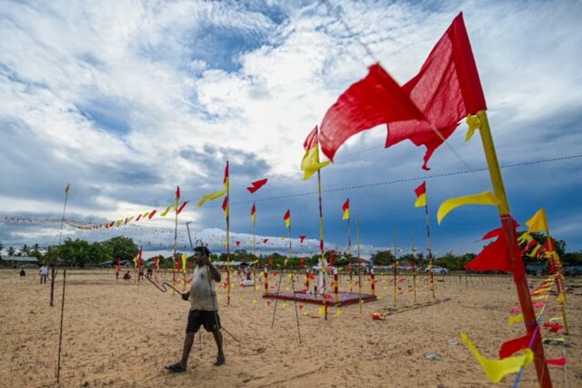 Volunteers prepare a venue on the eve of a commemoration ceremony at Mullivaikkal village