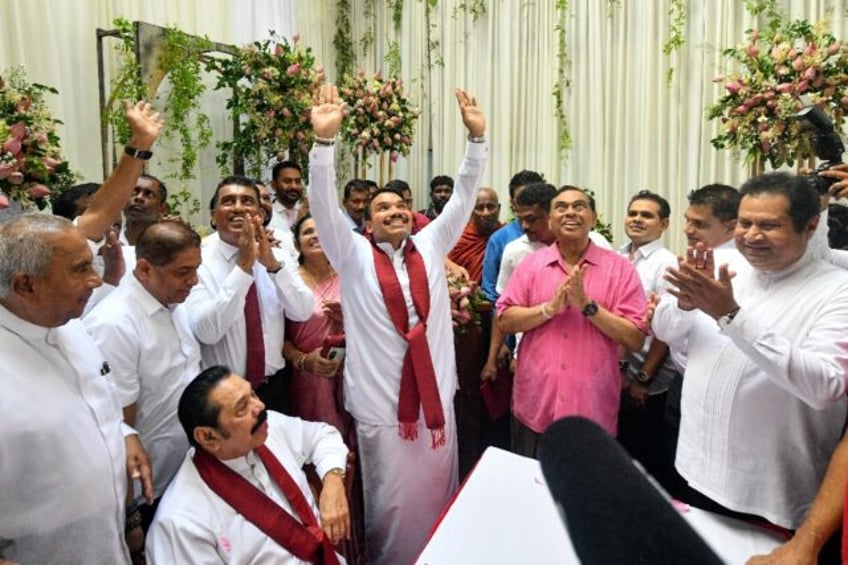 Namal Rajapaksa (C) gestures after the Sri Lanka Podujana Peramuna (SLPP) party named him