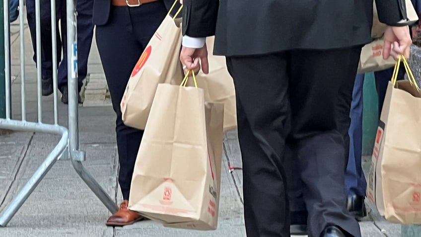 staff delivers at least 6 yuge bags of mcdonalds to trump trial in manhattan