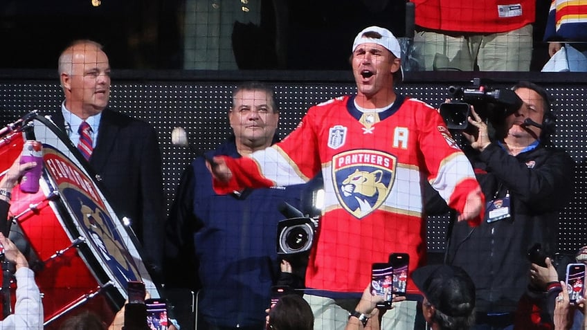 Golfer Brooks Koepka bangs a drum to start the game between the Florida Panthers and Vegas Golden Knights in Game 4 of the 2023 NHL Stanley Cup Final at then-FLA Live Arena on June 10, 2023, in Sunrise, Florida.