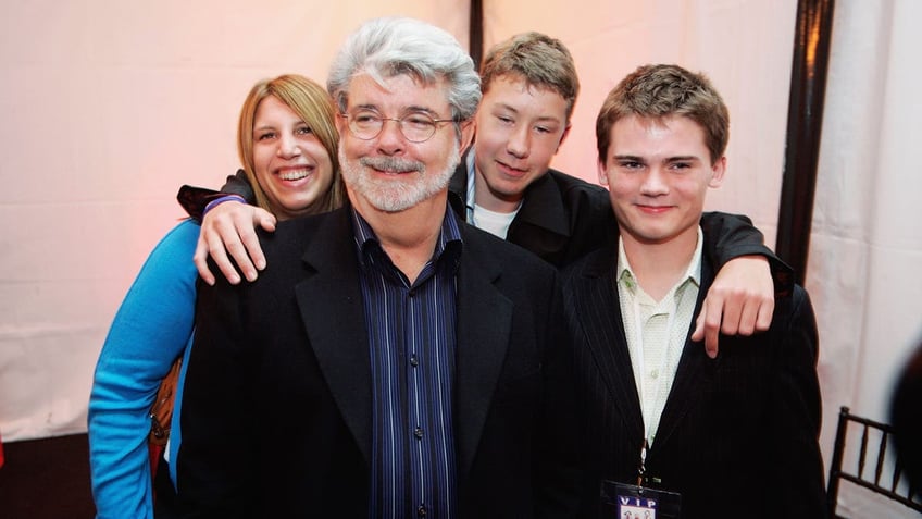 George Lucas director of Star Wars, Amanda Lucas, Jett Lucas and Jake Lloyd attend the after party of the San Francisco World Premiere of Star Wars: Episode III Revenge of the Sith at the Loews Theaters