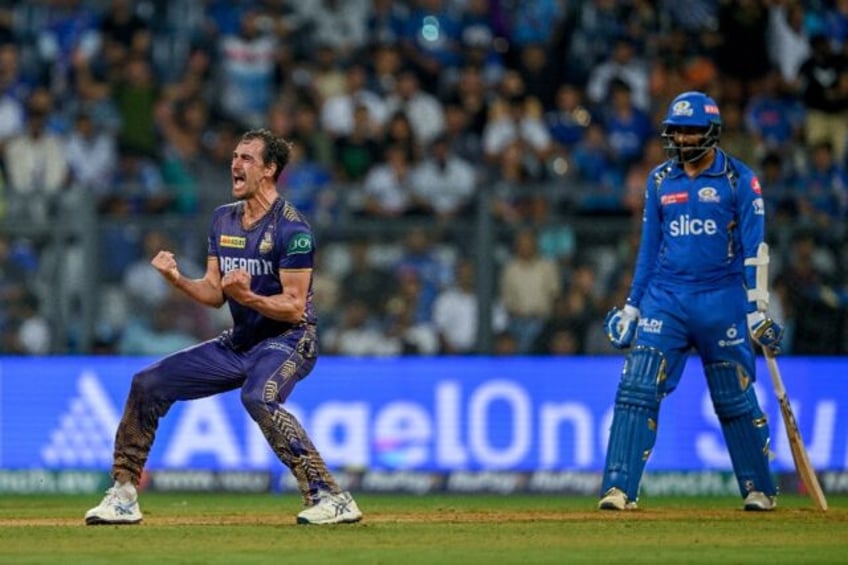 Kolkata Knight Riders' Mitchell Starc (L) celebrates after his team's win against Mumbai I