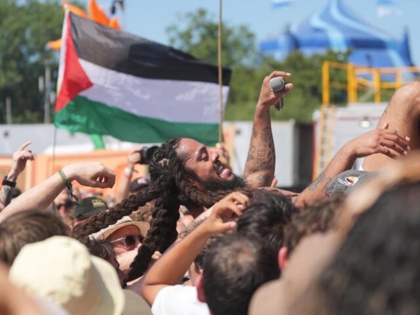 Previously unissued photo dated 28/6/2025 of Bob Vylan crowd surfs during his performance