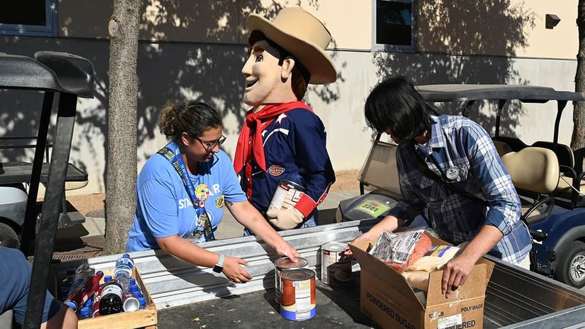 State fair of Texas food drive with cowboy mascot.