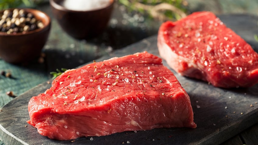 Uncooked steaks resting.