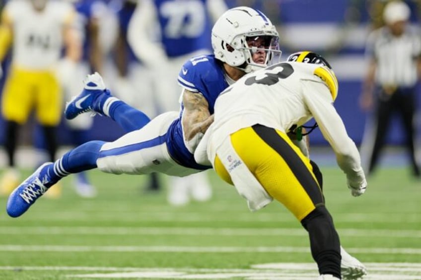 Michael Pittman Jr. #11 of the Indianapolis Colts and Damontae Kazee #23 of the Pittsburgh Steelers collide during the second quarter of Saturday's game