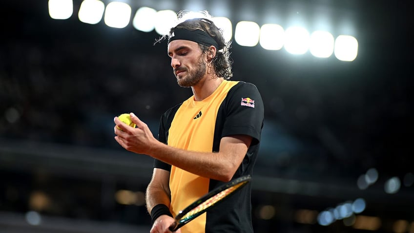 Stefanos Tsitsipas prepares to serve