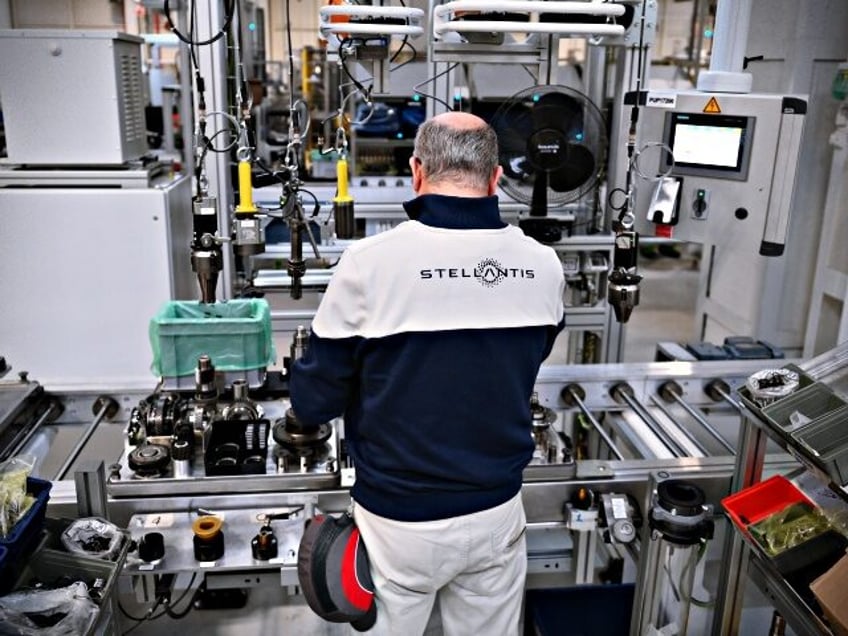 TURIN, ITALY - APRIL 10: Workers at work inside of the new Hybrid and PHEV Vehicles Stella